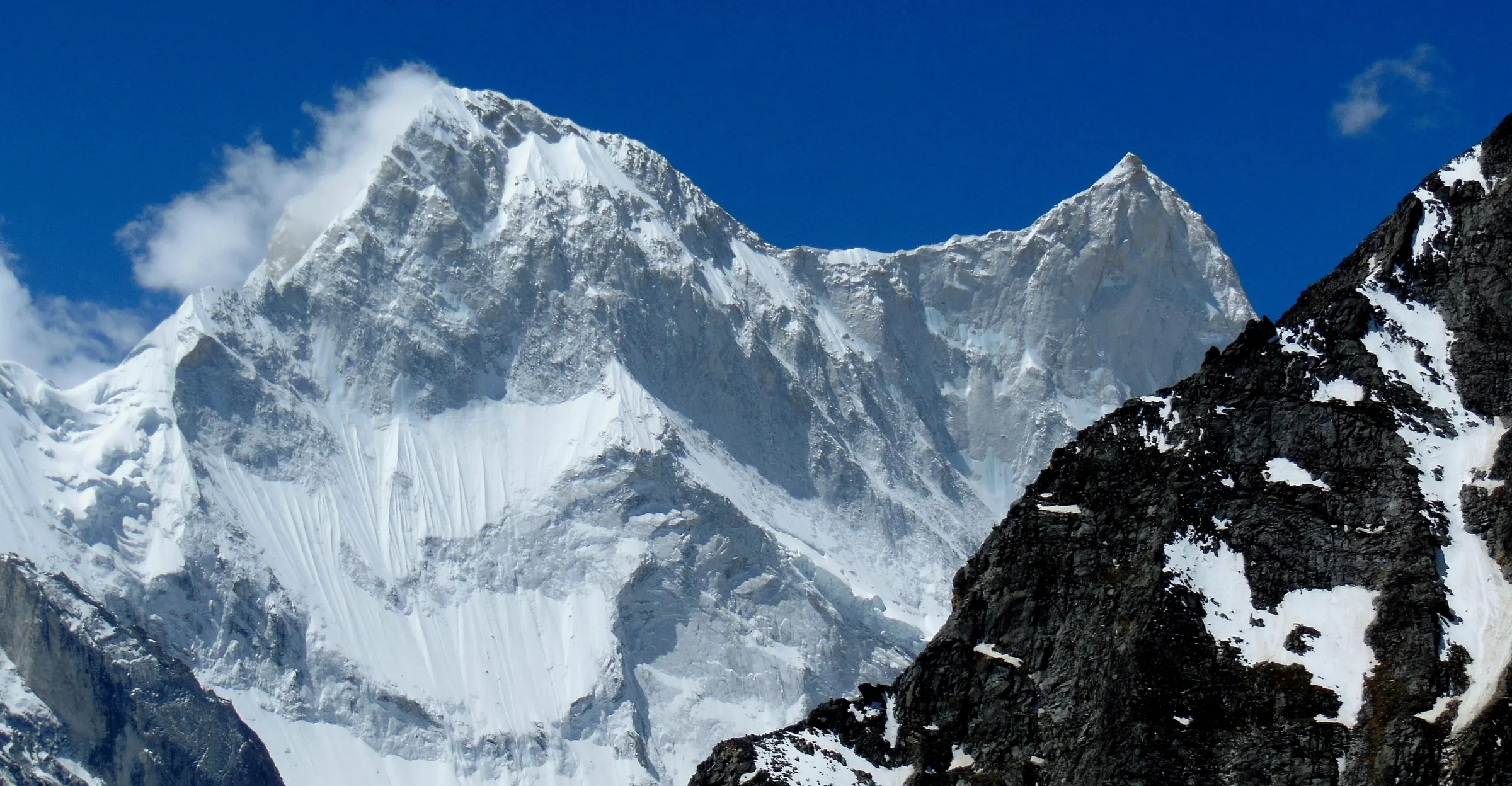 Trekkers on the moraine of Bagini glacier below Changabang